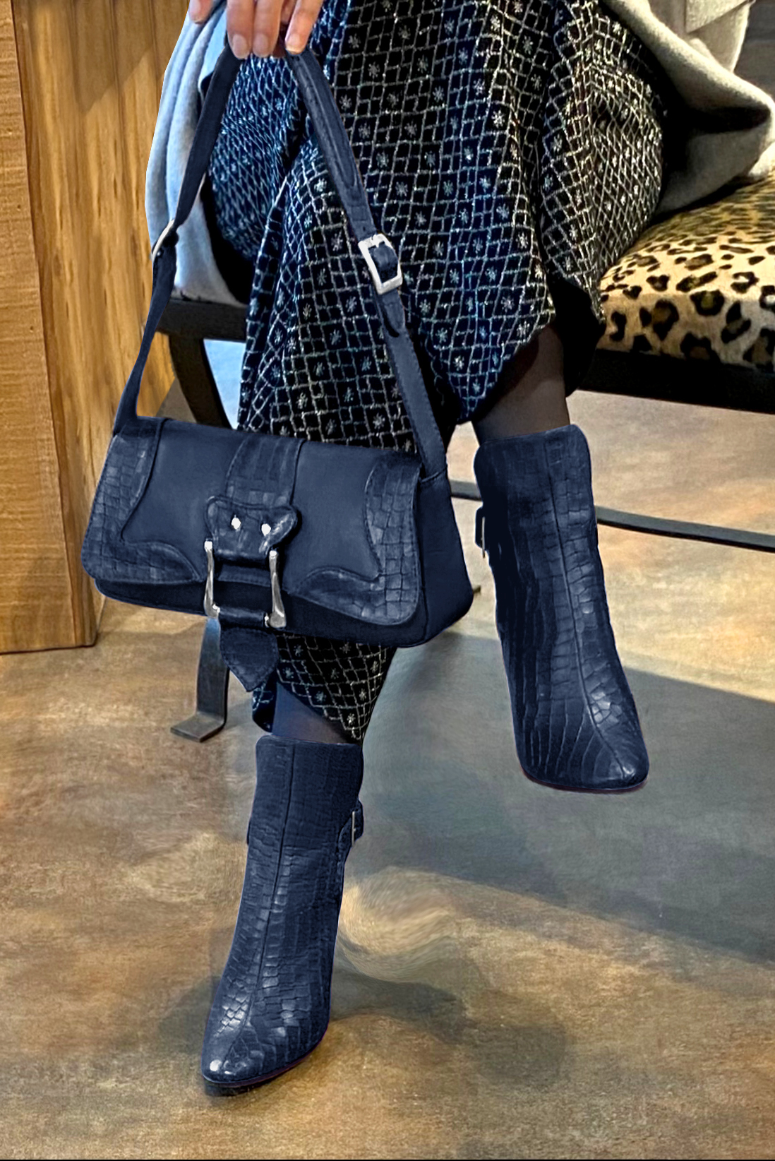 Navy blue women's ankle boots with buckles at the back. Round toe. High kitten heels. Worn view - Florence KOOIJMAN